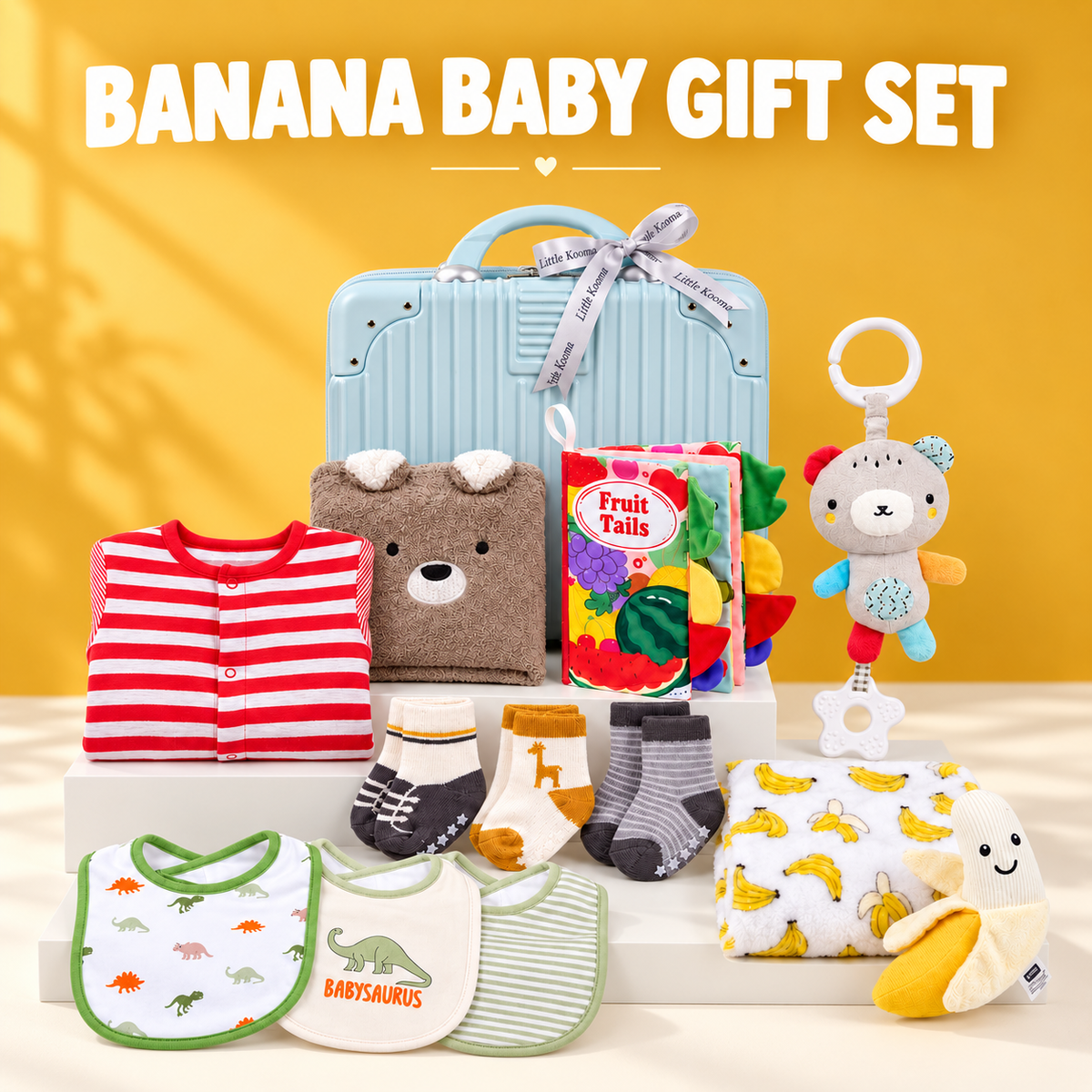 Banana baby gift set with blue suitcase, striped romper, bear towel, cloth book, socks, bibs, banana blanket and plush