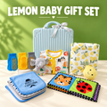 Lemon baby gift set with blue suitcase, animal-print sleepsuit, lemon blanket, socks, burp cloths, elephant rattle and cloth book