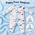 White puppy-print cotton footed baby sleepsuit with pale blue front popper trim